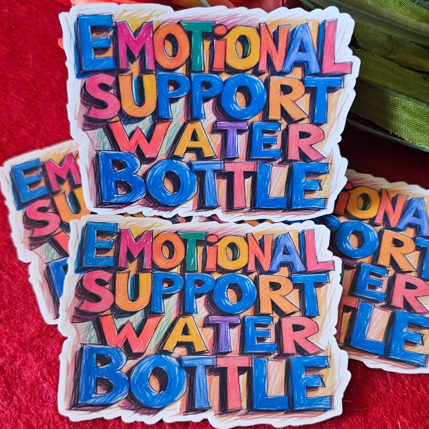 Colorful 'Emotional Support Water Bottle' stickers on a red background with flowers.
