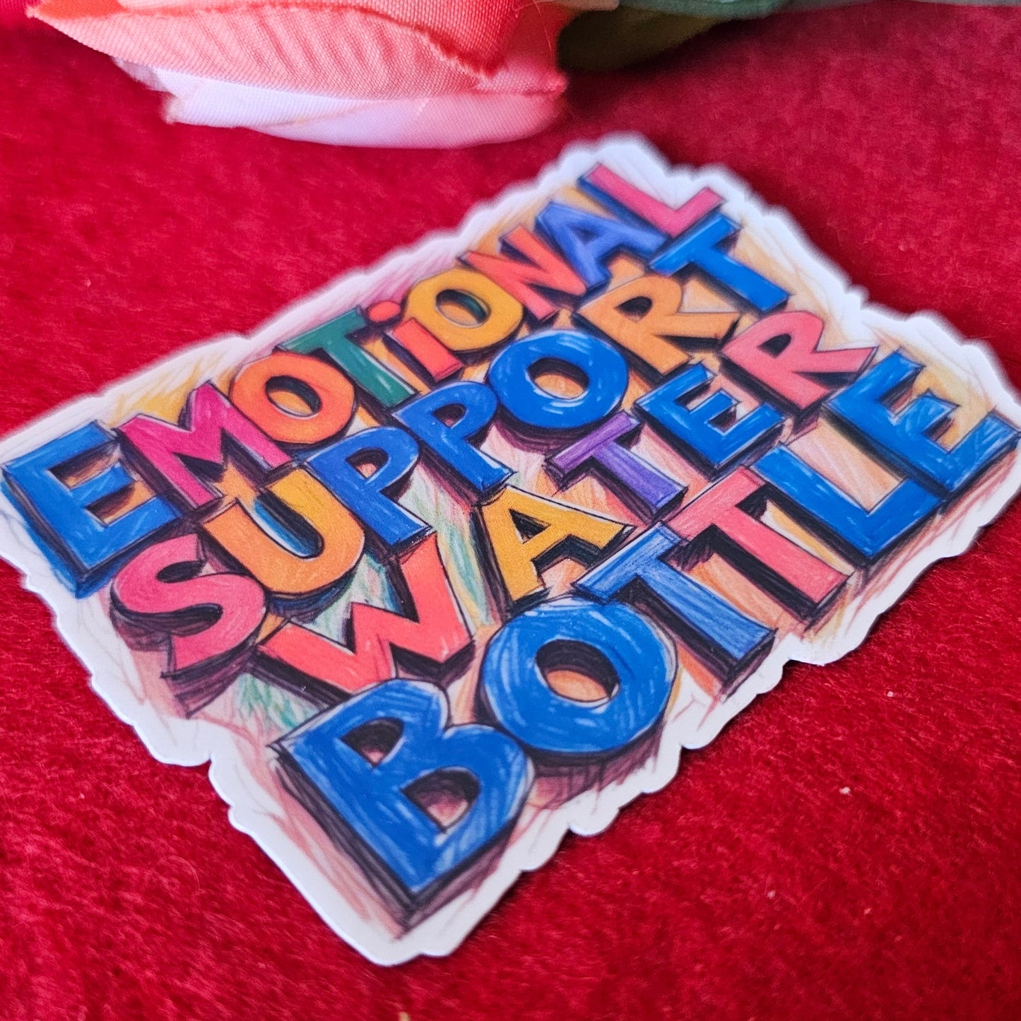 Colorful letterpress block with text on a red background