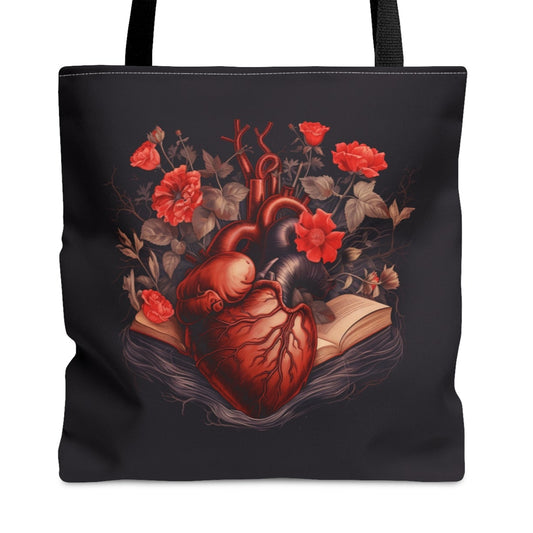 Black tote bag with a design of a heart and flowers on a white background