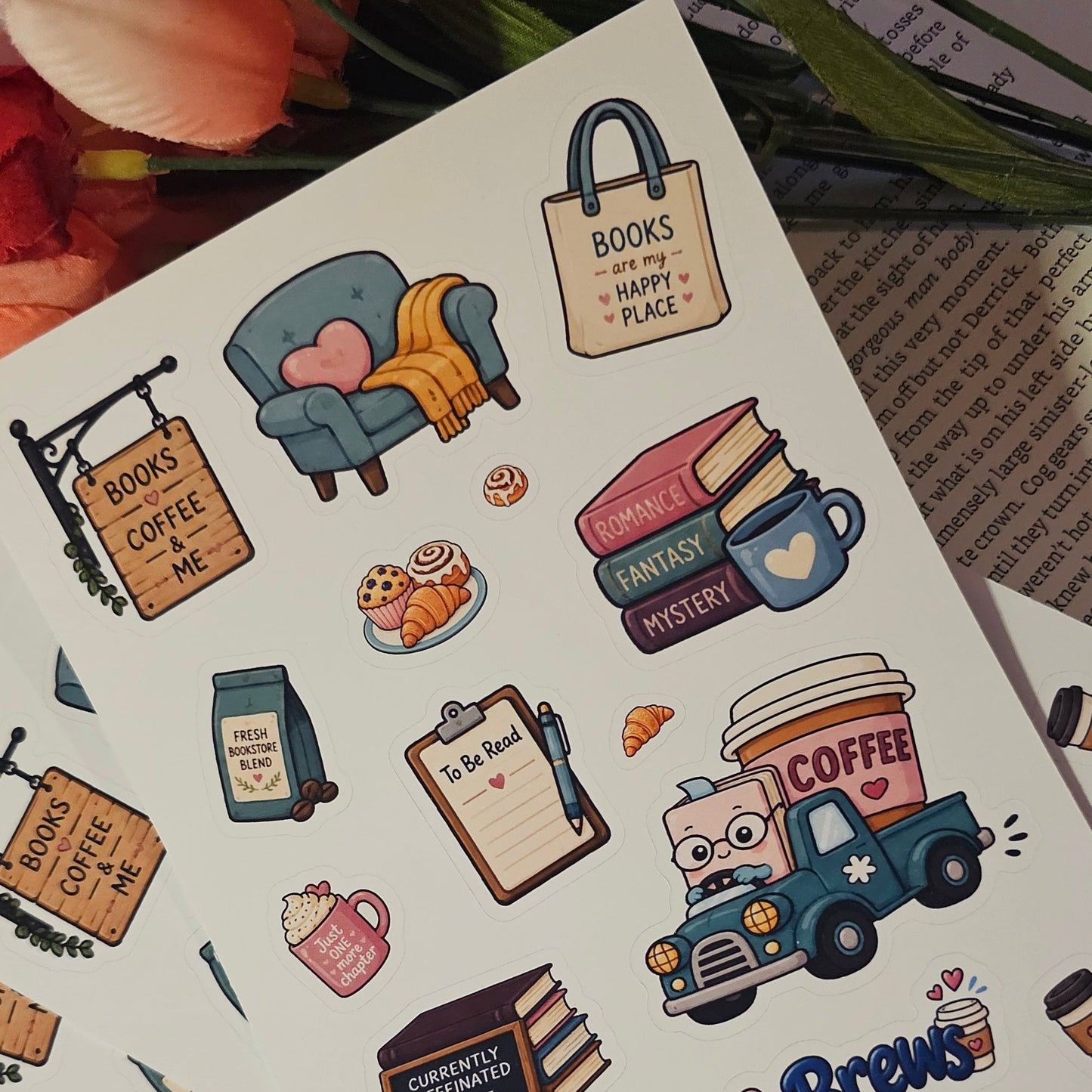 A sheet of cute, whimsical planner stickers themed around books and coffee, displayed on a lined notebook with decorative flowers in the background.