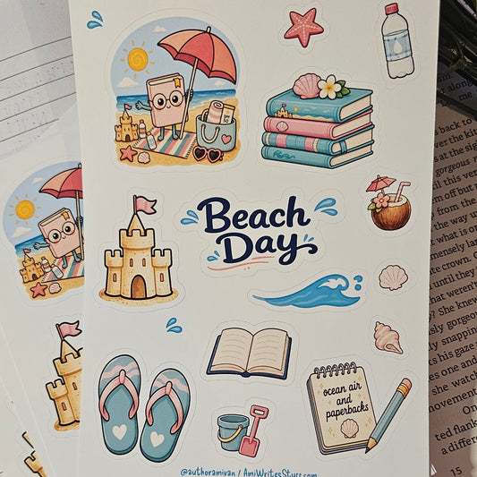 A sheet of beach-themed sticker decals displayed on a lined notebook page, surrounded by other sticker sheets and a red fabric surface.